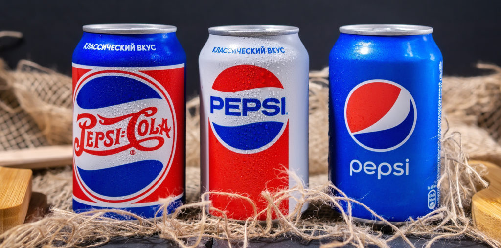 Three Pepsi cans displayed side by side