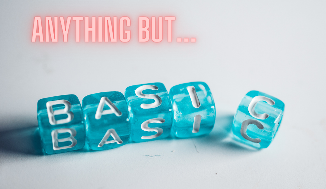 Image with "Anything but..." in light orange neon letters followed by teal dice reading "basic".