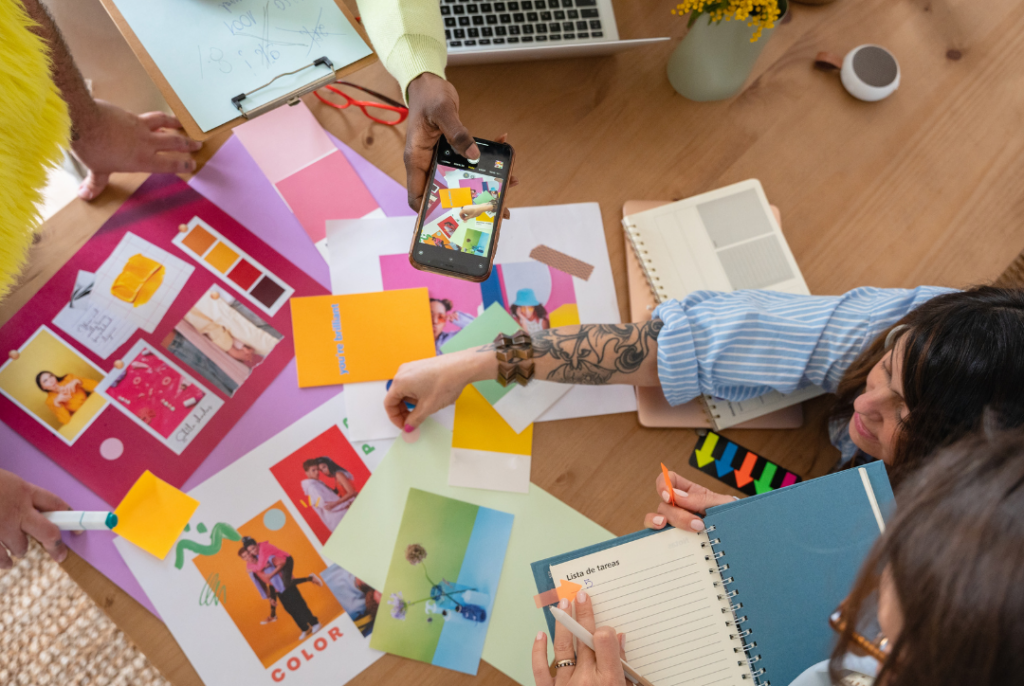 an image of a table covered in branding materials - one of the 6 ways we make your business look good