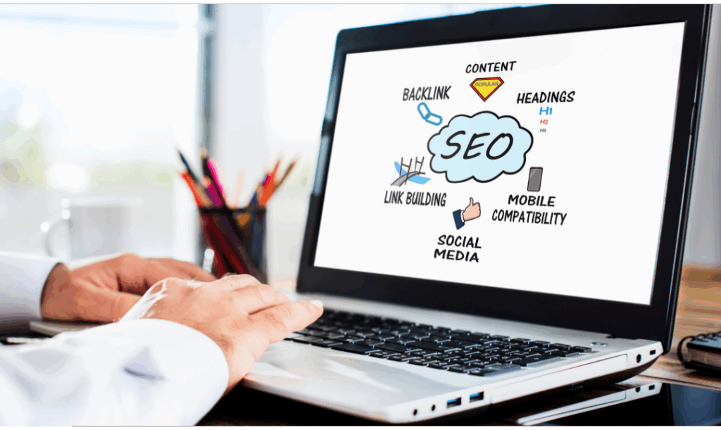 an image of a laptop with SEO written on it - Paying attention to SEO is one tip on the end of year marketing checklist